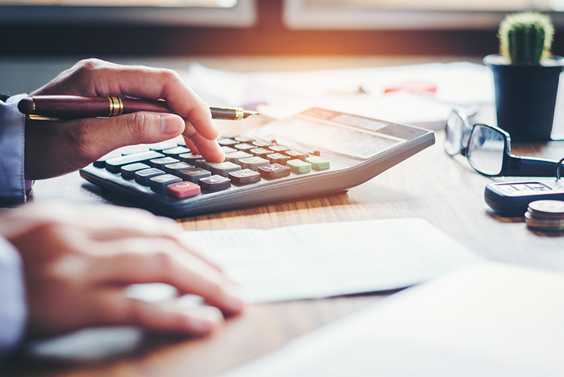 Person calculating finances